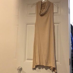 flowy dress w/ material draped around neck.